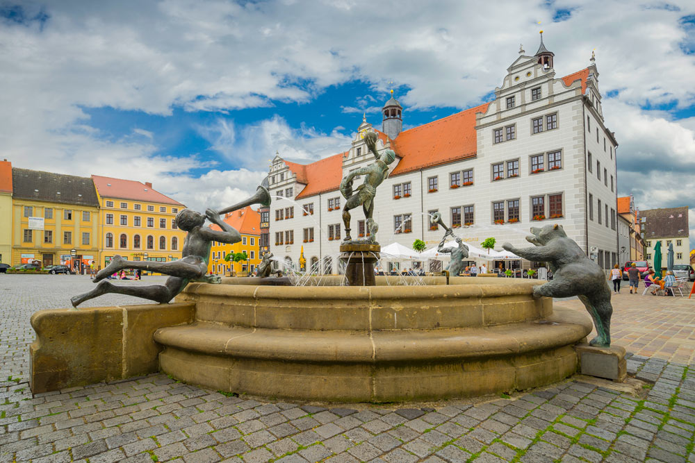 Brunnen am Marktplatz Torgau Musikanten und Narr